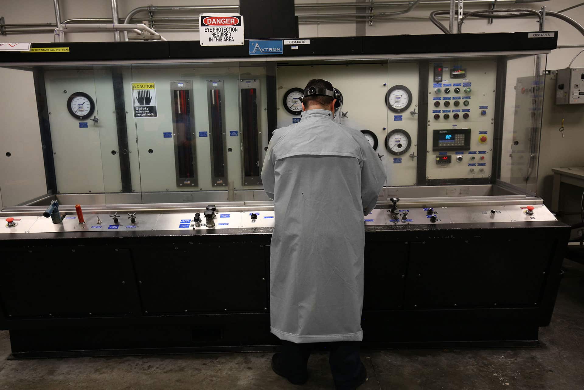 Technician working at a hydraulic test stand