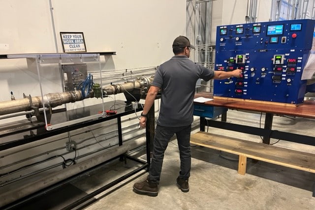 A technician working at a pneumatic test stand.