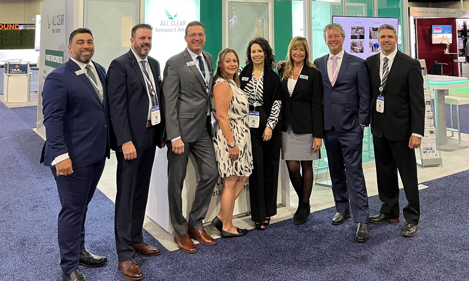 A row of All Clear Employees at a tradeshow